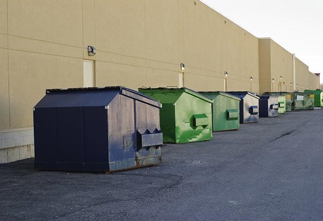 a row of industrial dumpsters at a construction site in Aurora, OR